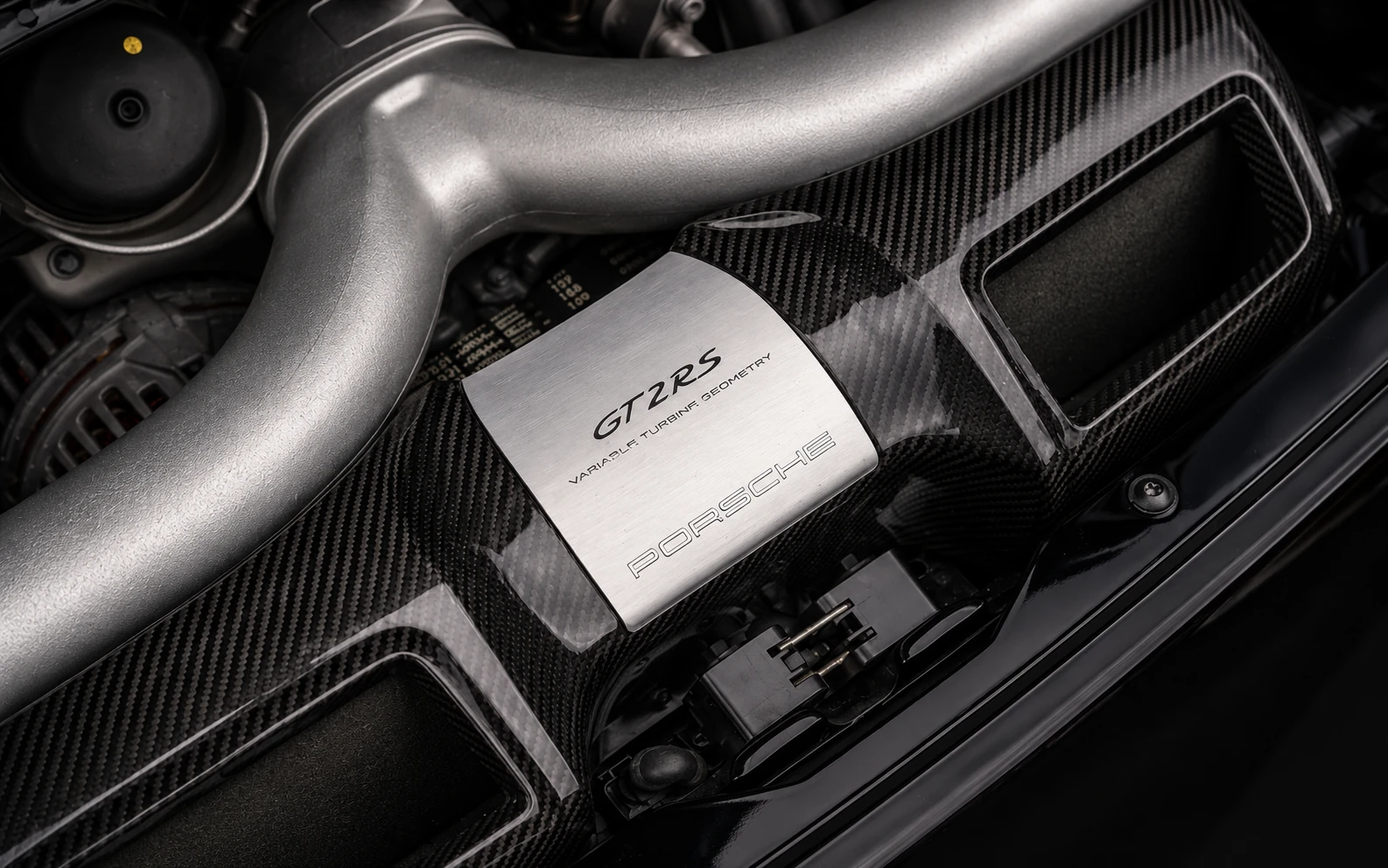 GT2 RS engine cover reading Variable Turbine Geometry, framed in carbon fibre under the rear lid