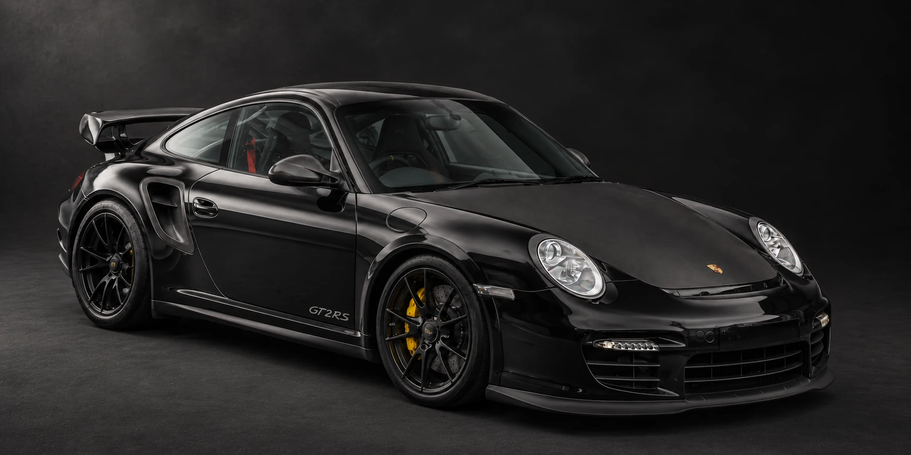 Rear three-quarter view of the Porsche 911 GT2 RS showing its rear wing and GT2 RS script